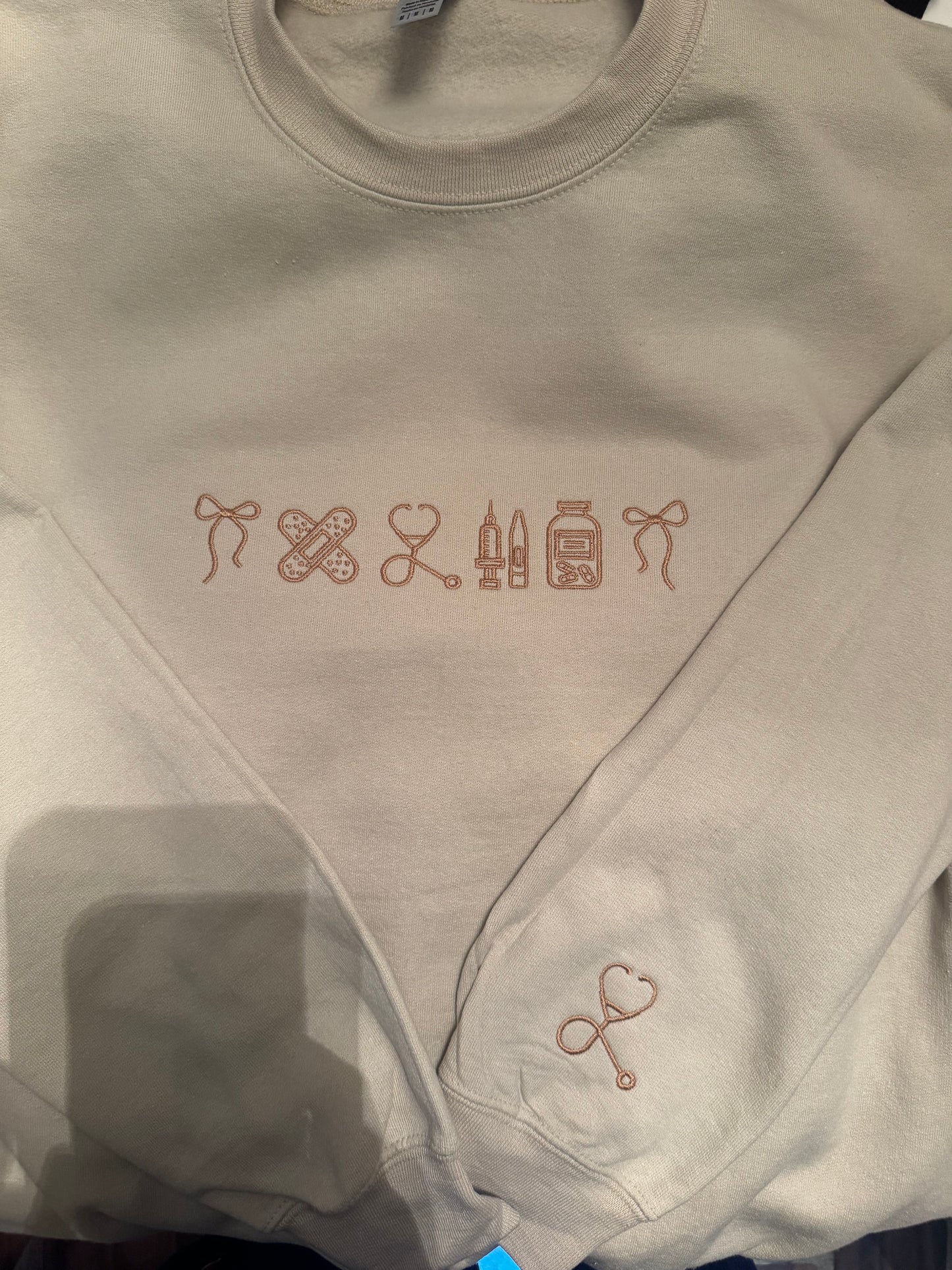 Neutral Nurse Crewneck – Line Art Medical Icons Embroidery | Nurse Appreciation Sweatshirt | Stethoscope, Bandage, Syringe, Pill Bottle | Custom Embroidery